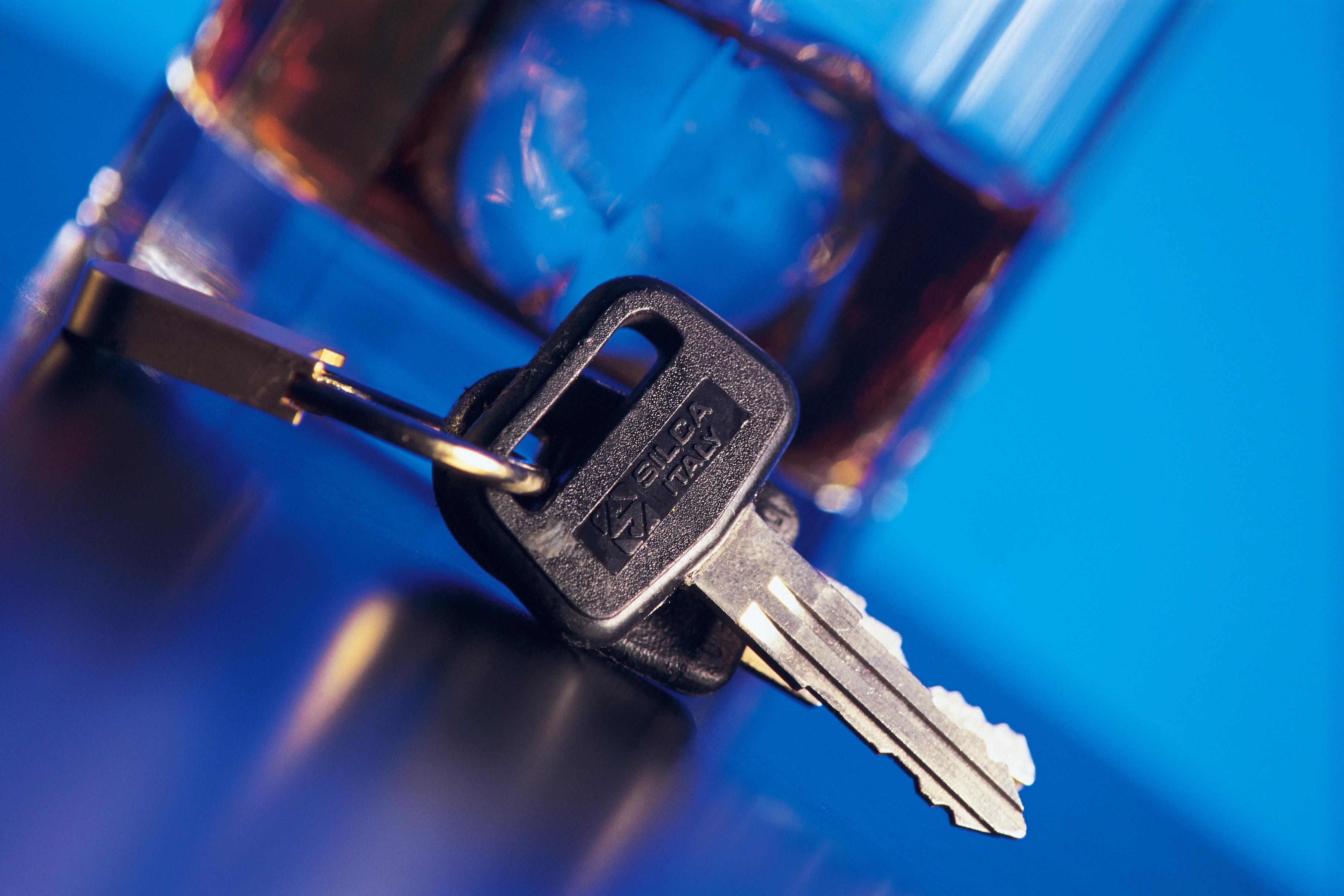 Car keys next to alcoholic beverage