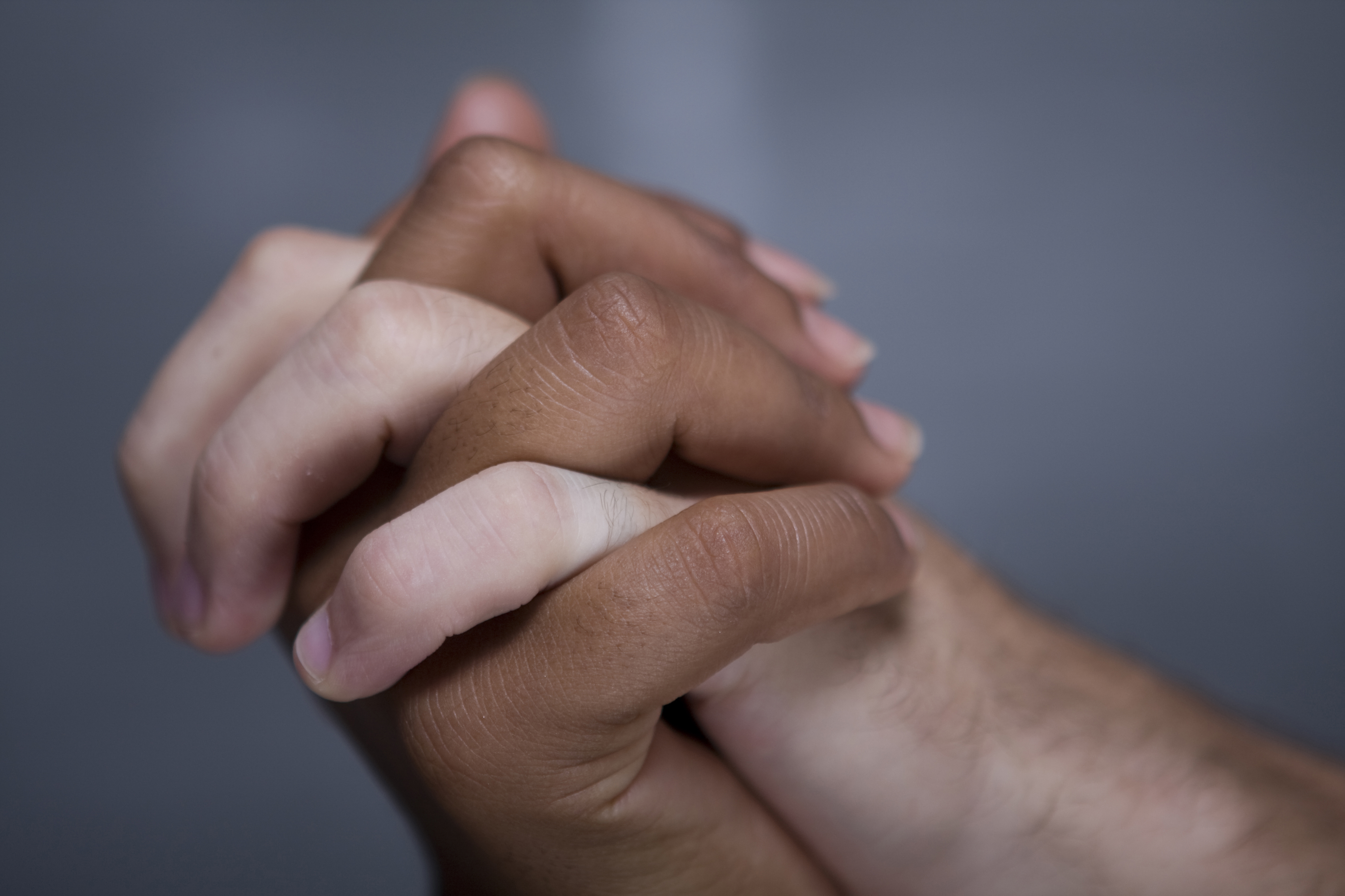 Close-up of couple holding hands