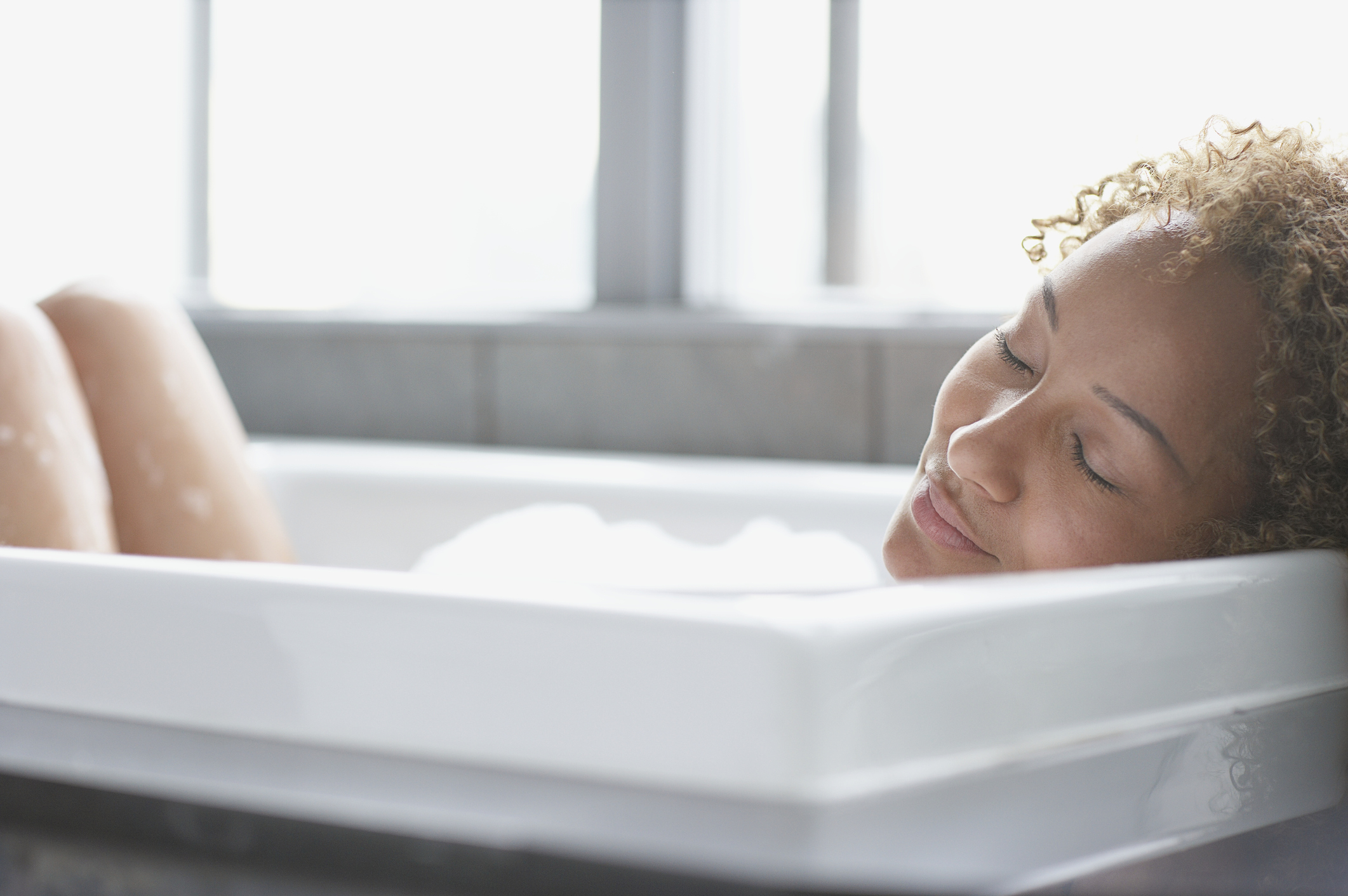 Woman taking relaxing bath