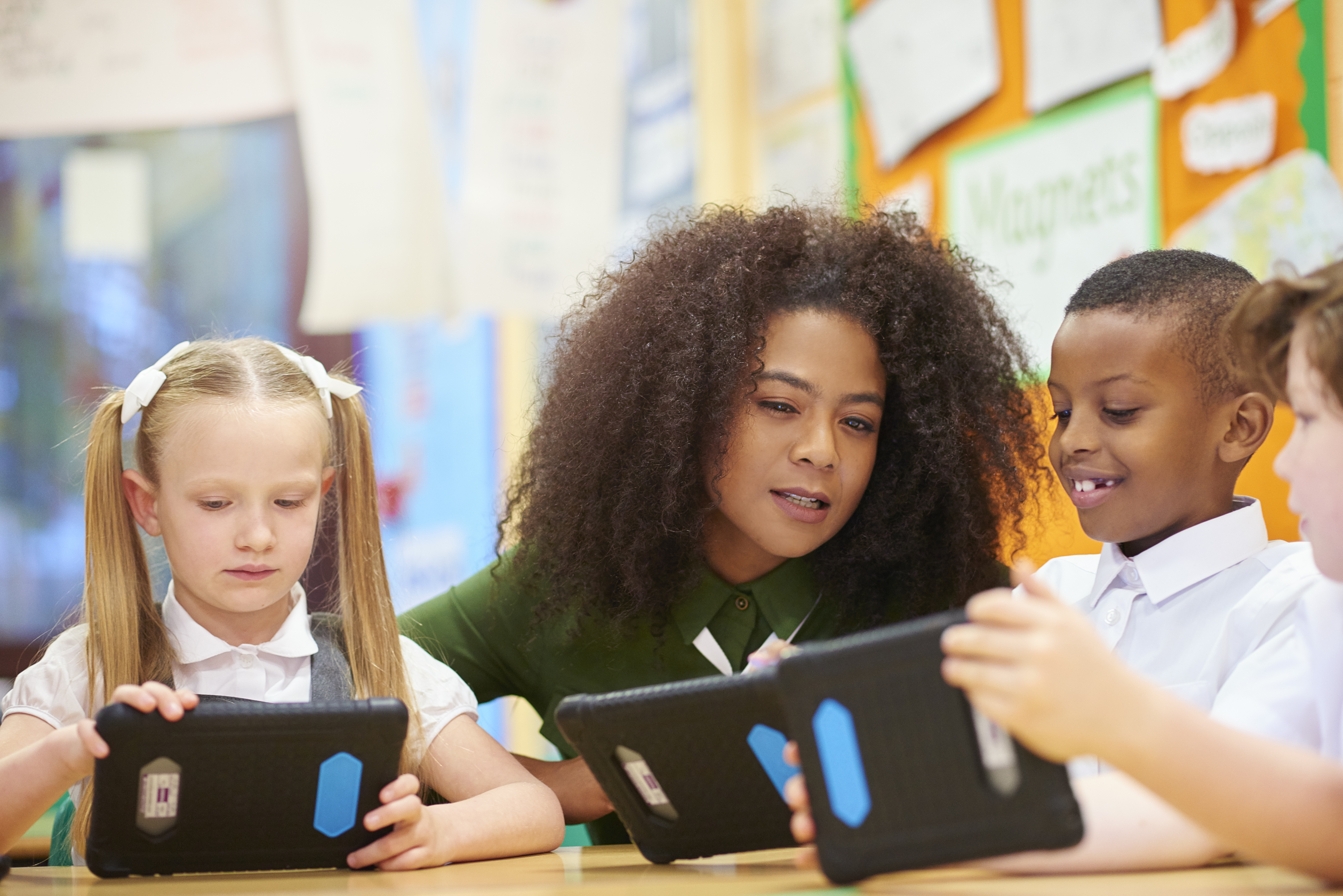 teacher and students learning digitally