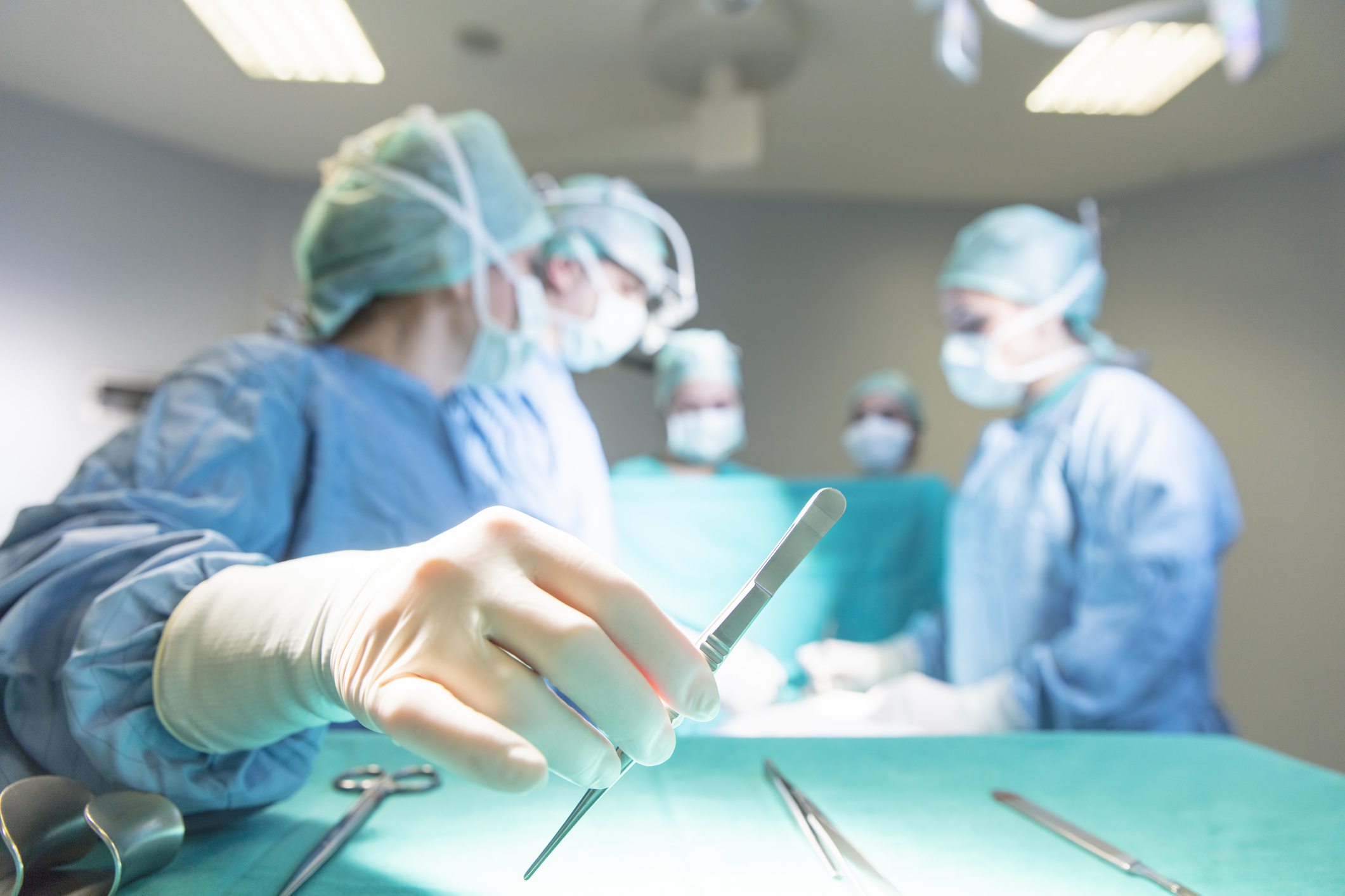 Surgeons in full surgical gear during operation
