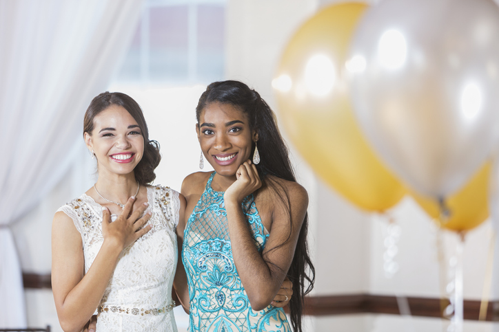 Two multi-ethnic teenage girls dressed for special event