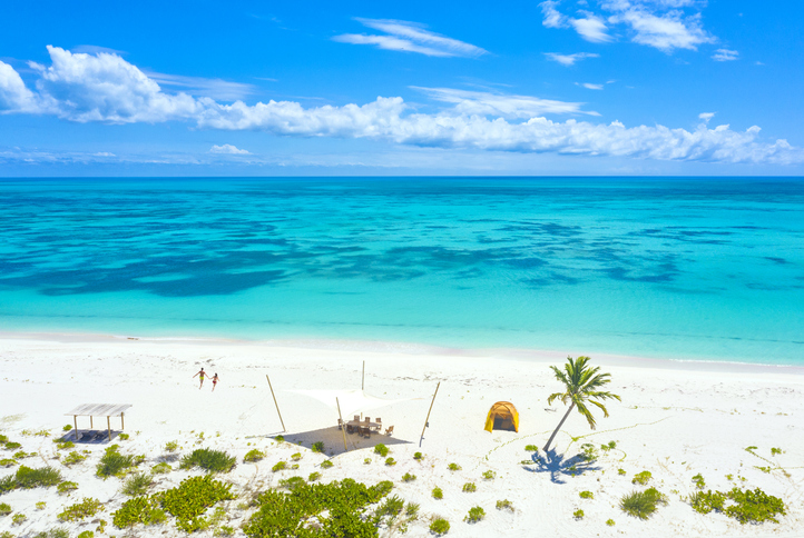 Aerial view of man and woman on Pink Sand Beach, Caribbean