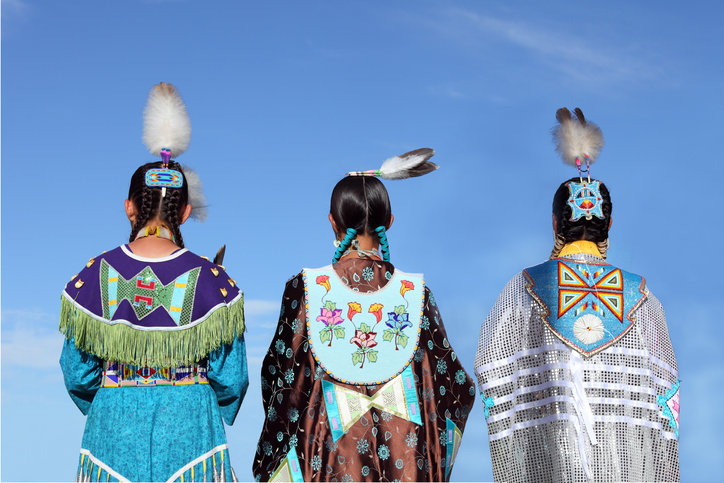 Native Americans in traditional dress at pow-wow