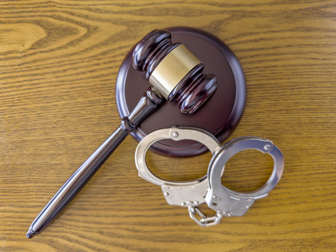 Judge gavel and handcuffs